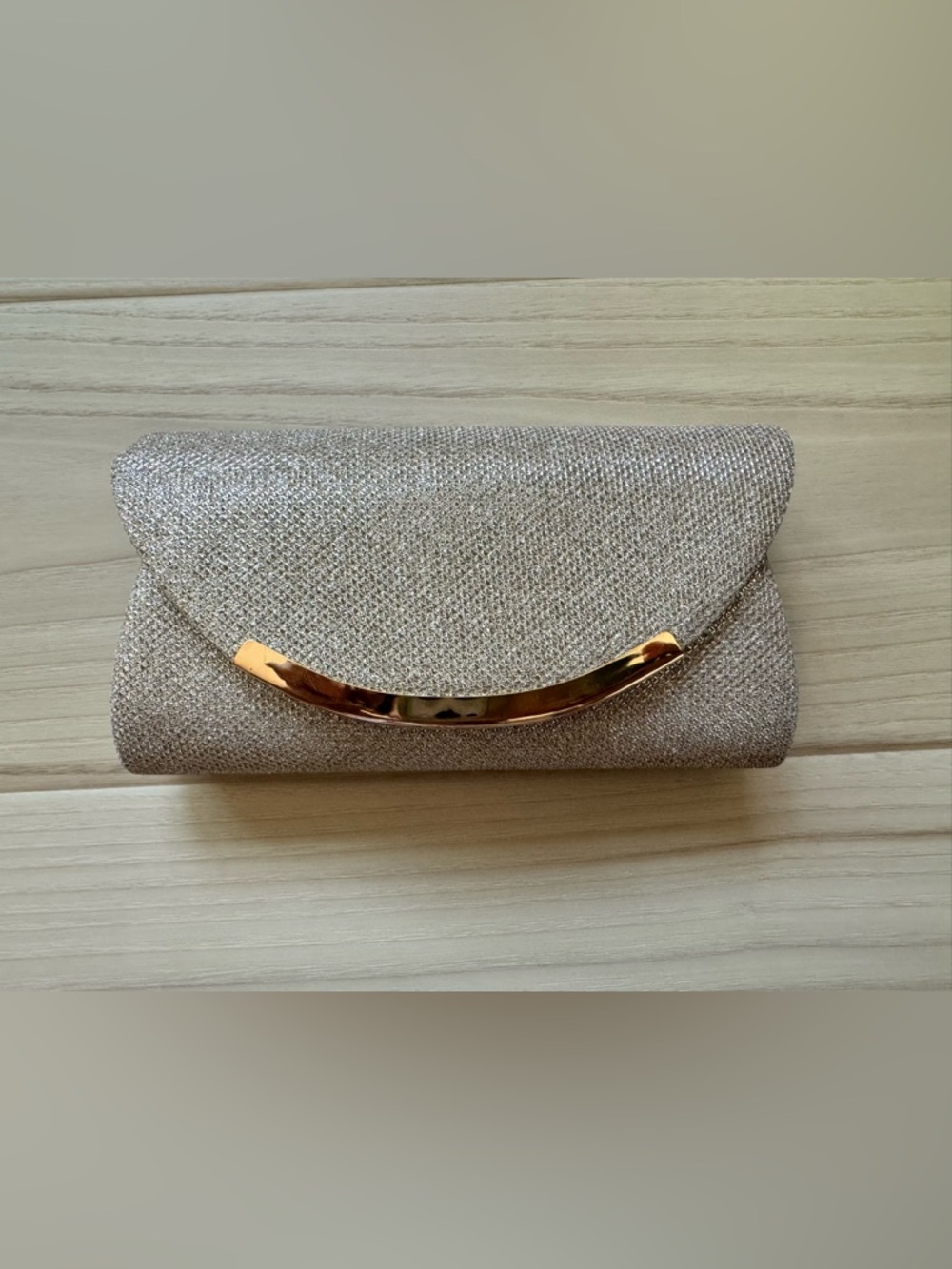 Elegant Sparkle Clutch Handbag in Champagne Gold. Crossbody metallic chain